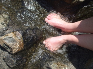 feet over rushing water